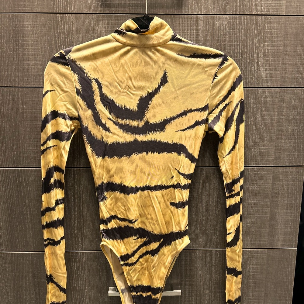 Ronny Kobo 100% viscose bodysuit tiger print in a warm golden color.